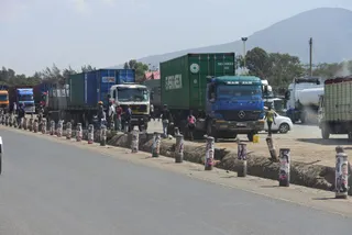 Container trucks lined up along the Nakuru–Nairobi road at Mai Mahiu, Kenya